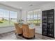 Sitting area with windows offering plentiful natural light, wicker chairs, and a black storage cabinet at 337 Brinkley Cir, Mebane, NC 27302