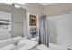 Bathroom featuring a white vanity, framed mirror, and a shower-tub combination at 3400 Secretariat Way, Raleigh, NC 27614