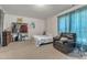 Bright bedroom featuring a comfortable leather armchair, and an ample storage rack at 3400 Secretariat Way, Raleigh, NC 27614