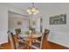 Inviting dining room with round table, seating for four, and bright natural light at 3400 Secretariat Way, Raleigh, NC 27614