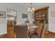 Traditional dining room with round table, upholstered chairs, and a wooden china cabinet at 3400 Secretariat Way, Raleigh, NC 27614
