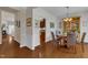 Inviting dining room with hardwood floors, a china cabinet and seating for four at 3400 Secretariat Way, Raleigh, NC 27614