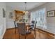 Elegant dining room with hardwood floors, built-in china cabinet, and bright window at 3400 Secretariat Way, Raleigh, NC 27614