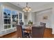 Dining area featuring a round table, seating for four, and large windows at 3400 Secretariat Way, Raleigh, NC 27614