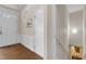 Welcoming foyer featuring white trim, hardwood floors, and staircase access at 3400 Secretariat Way, Raleigh, NC 27614