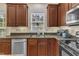 Close up shot of the kitchen featuring stainless steel appliances, granite countertops, and stylish cabinets at 3400 Secretariat Way, Raleigh, NC 27614