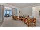 Cozy living room featuring natural light, neutral walls, and bamboo-style furnishings at 3400 Secretariat Way, Raleigh, NC 27614