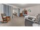 Open living space featuring a curtain partition, workout equipment, and comfortable seating at 3400 Secretariat Way, Raleigh, NC 27614