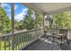 The covered porch provides a relaxing outdoor space to enjoy the beautiful neighborhood views at 3400 Secretariat Way, Raleigh, NC 27614