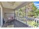 Relax on this screened porch overlooking the serene surroundings at 3400 Secretariat Way, Raleigh, NC 27614