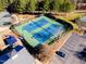 Aerial view of community tennis courts with parking at 3400 Secretariat Way, Raleigh, NC 27614