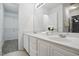 Bathroom featuring a double sink vanity and a view into a walk-in closet at 353 Spearhead Pl, Clayton, NC 27520