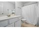 Bathroom featuring a white vanity, toilet, and shower with white shower curtain at 353 Spearhead Pl, Clayton, NC 27520