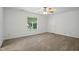 Bedroom featuring a ceiling fan, a window, and neutral carpet flooring at 353 Spearhead Pl, Clayton, NC 27520