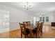 Charming dining room featuring hardwood floors and a view to the kitchen at 353 Spearhead Pl, Clayton, NC 27520