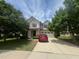 Charming two-story home featuring a two-car garage, well-maintained lawn, and mature trees at 3927 Wedonia Dr, Cary, NC 27519