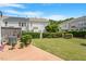 Well-maintained backyard featuring green lawn and manicured hedges, perfect for outdoor enjoyment at 401 Dyersville Dr, Morrisville, NC 27560