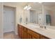 Bathroom features a double vanity, framed mirror, and shower at 401 Dyersville Dr, Morrisville, NC 27560