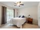 Bedroom with carpeted floor, ceiling fan, and window at 401 Dyersville Dr, Morrisville, NC 27560