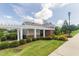 Beautiful clubhouse with a pergola, well-maintained lawn, and colorful flowerbeds at 401 Dyersville Dr, Morrisville, NC 27560