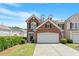 Charming brick front home with a two-car garage, well-manicured lawn, and mature landscaping at 401 Dyersville Dr, Morrisville, NC 27560