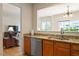 Well-lit kitchen featuring granite countertops, stainless steel appliances and hardwood floors at 401 Dyersville Dr, Morrisville, NC 27560