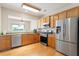 Modern kitchen with stainless steel appliances and granite countertops at 401 Dyersville Dr, Morrisville, NC 27560