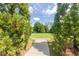Scenic view of a park with mature trees and a brick-paved walkway at 401 Dyersville Dr, Morrisville, NC 27560