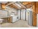 Spacious unfinished basement area with washer, dryer, and water heater, ready for customization at 4030 King Charles Rd, Durham, NC 27707