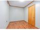 This multi-use room has wood-look floors, neutral colors, and a door for privacy at 4030 King Charles Rd, Durham, NC 27707