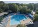 The community pool surrounded by lounge chairs offers the perfect place to relax on summer days at 441 Heritage Village Ln, Apex, NC 27502