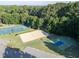 Aerial view of the community amenities, including the tennis court, volleyball, and basketball courts at 441 Heritage Village Ln, Apex, NC 27502