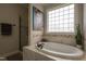Beautiful bathroom with large soaking tub, shower, and decorative wall art at 441 Heritage Village Ln, Apex, NC 27502