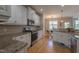 Modern kitchen featuring granite countertops, stainless steel appliances, and an open layout at 441 Heritage Village Ln, Apex, NC 27502