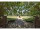 Lush park with mature trees, walking path, and open green space at 441 Heritage Village Ln, Apex, NC 27502