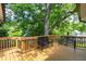 Wooden deck with seating and stairs leading to yard at 4906 Lakemont Dr, Raleigh, NC 27609