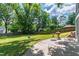 Enjoy outdoor living in the spacious backyard with patio, lawn, and mature trees at 4906 Lakemont Dr, Raleigh, NC 27609
