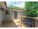Outdoor deck with wood-stained railings, black bench, and backyard view at 4906 Lakemont Dr, Raleigh, NC 27609