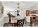 Dining area with a view of the kitchen and living room, creating an ideal space for entertaining at 4906 Lakemont Dr, Raleigh, NC 27609