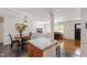 Dining Room that opens to the living room showing dark planking and white trim at 4906 Lakemont Dr, Raleigh, NC 27609