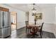 Breakfast area with stainless fridge, stylish lighting and trim at 4906 Lakemont Dr, Raleigh, NC 27609