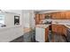 Kitchen with granite countertops, stainless appliances and eat-in island open to the dining and living room at 4906 Lakemont Dr, Raleigh, NC 27609