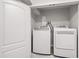 Bright laundry room features modern appliances, promising ease and convenience on laundry days at 4906 Lakemont Dr, Raleigh, NC 27609