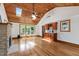 Cozy living space featuring a stone fireplace, wood ceiling, and a built in bar at 4906 Lakemont Dr, Raleigh, NC 27609
