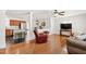 Comfortable living room featuring hardwood flooring, a ceiling fan, and easy access to the kitchen at 4906 Lakemont Dr, Raleigh, NC 27609