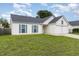 Lovely single-Gathering home features a two-car garage and a grassy front lawn at 503 Kinship Ln, Apex, NC 27502