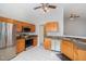 Bright kitchen with stainless steel appliances, ample cabinet space, and tile flooring for easy maintenance at 503 Kinship Ln, Apex, NC 27502