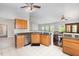 Well-equipped kitchen with ample counter space, stainless steel dishwasher, and a view of the dining area at 503 Kinship Ln, Apex, NC 27502