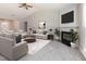 Inviting living room with vaulted ceiling, fireplace, and ample seating creating a cozy atmosphere at 503 Kinship Ln, Apex, NC 27502