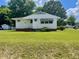 Charming single-story home with white siding and a well-maintained front lawn at 508 E Mcneill St, Lillington, NC 27546